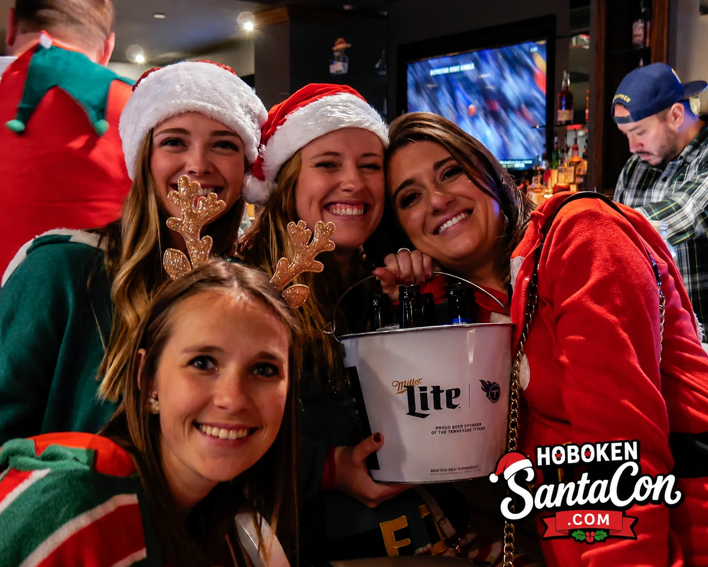 SantaCon friends with beer bucket