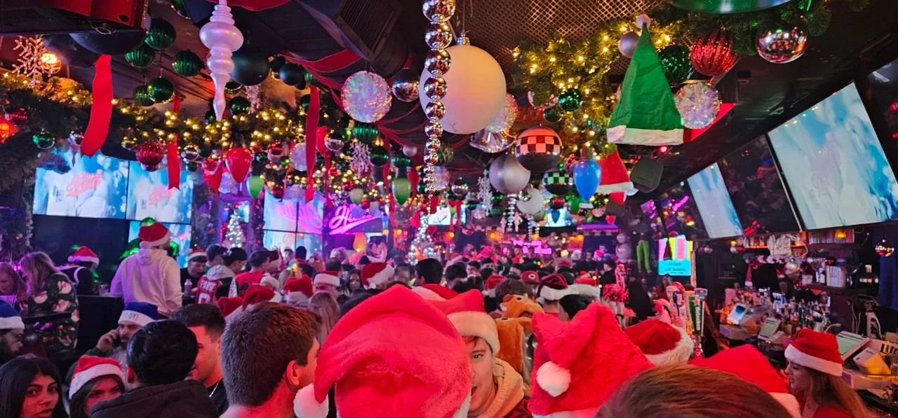 Hoboken SantaCon crowd inside a festive bar